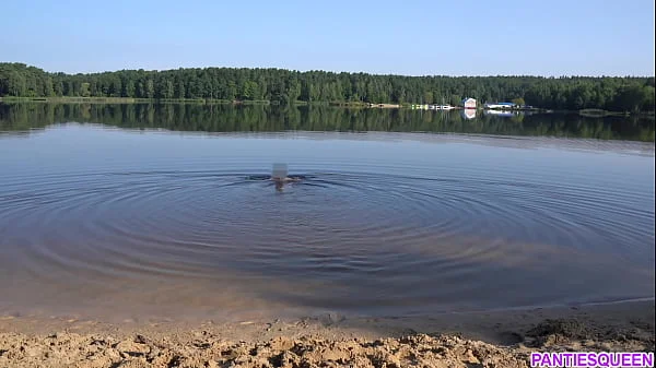 Naked girl goes skinny dipping in public beach